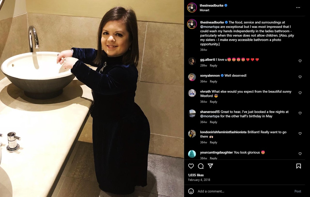 Instagram post showing Sinéad Burke smiling at the camera while putting her hands in the basin of a sink.